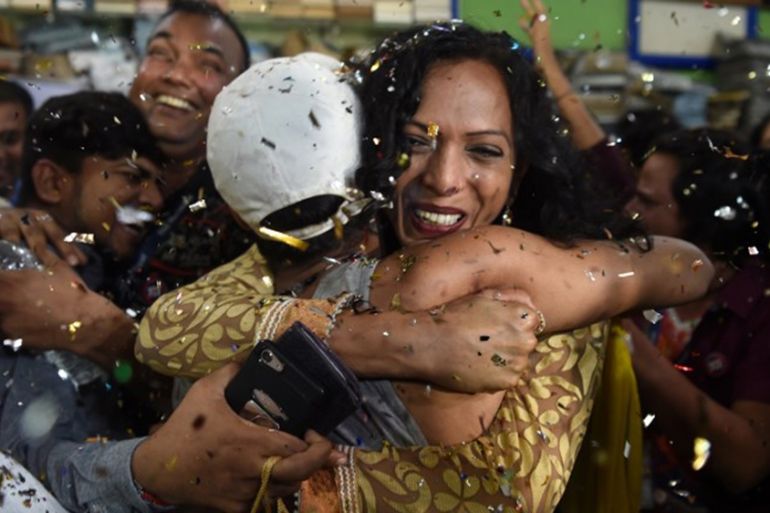 Indian members and supporters of the lesbian, gay, bisexual, transgender (LGBT) community celebrate the Supreme Court decision to strike down a colonial-era ban on gay sex, in Mumbai on September 6, 2