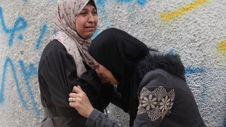Mourners react during the funeral of Palestinians killed in Israeli strikes, at Al-Shifa Hospital in Gaza City