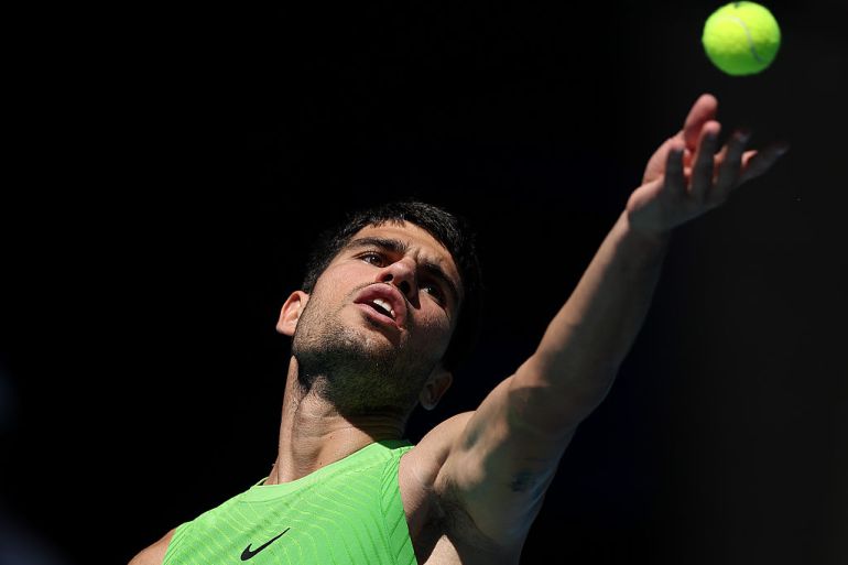 Carlos Alcaraz of Spain serves against Corentin Moutet of France in the Men's Singles Third Round during day six of the 2026 Australian Open